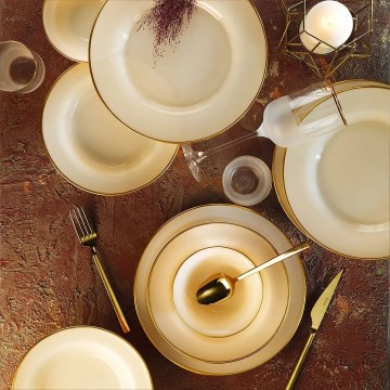 18-piece porcelain dinner set in beige with gold accents