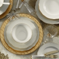 18-piece porcelain dinnerware set in white with gold accents