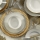 18-piece porcelain dinnerware set in white with gold accents