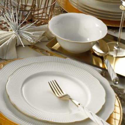 18-piece porcelain dinnerware set in white with gold accents