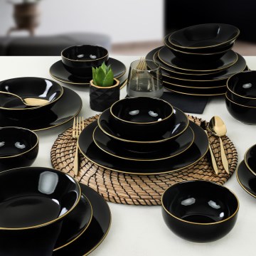 24-piece black stoneware dinner set with gold accents