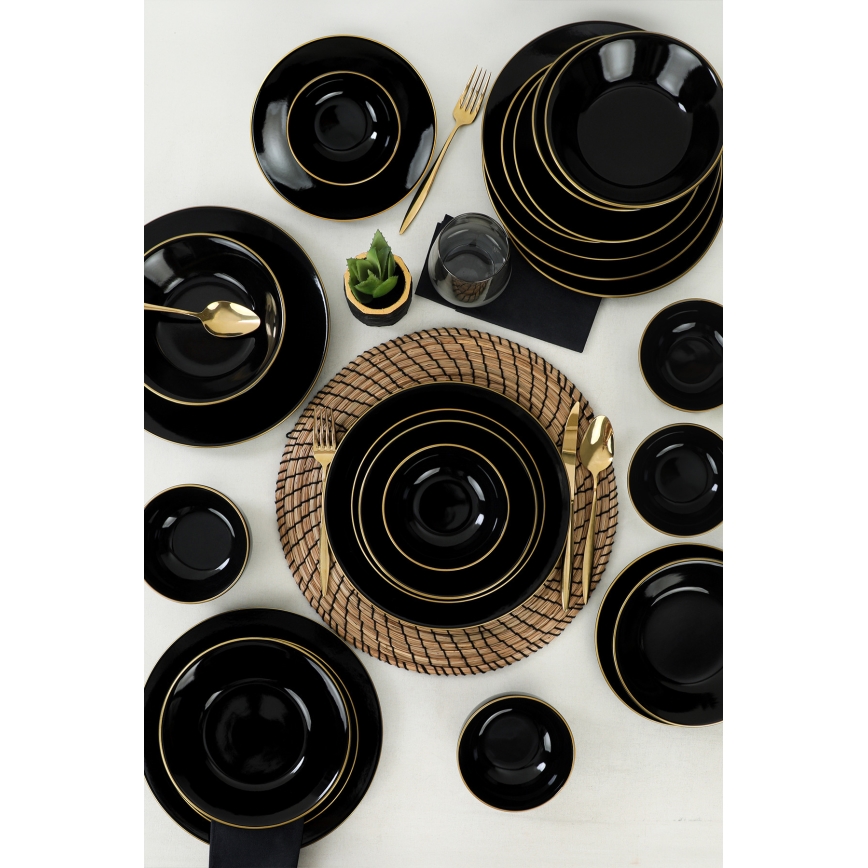 24-piece black stoneware dinner set with gold accents