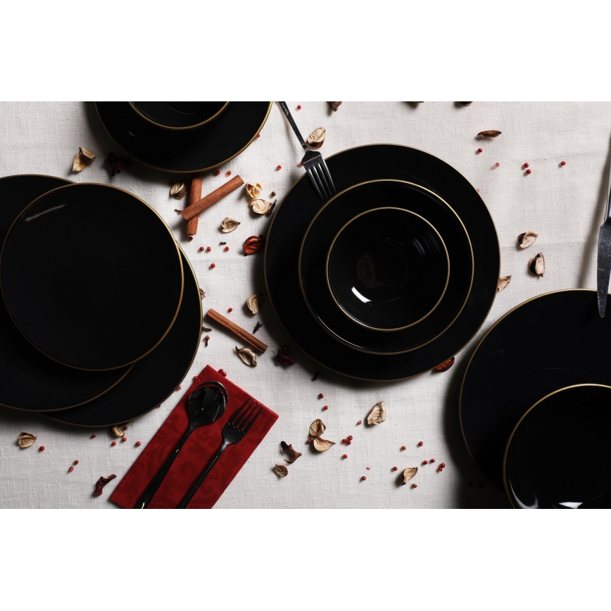24-piece black stoneware dinner set with gold accents