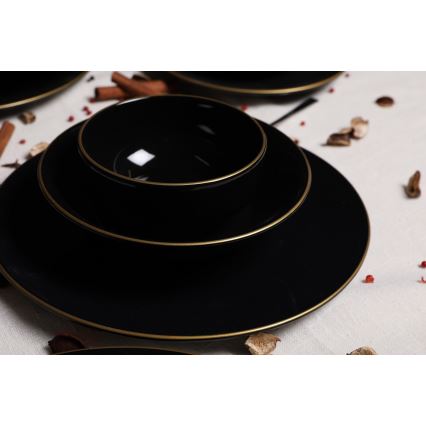 24-piece black stoneware dinner set with gold accents