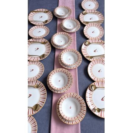 24-piece ceramic dinner set in white, red and gold