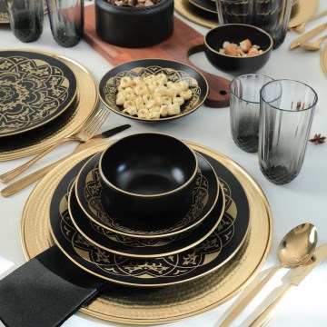 24-piece ceramic dinnerware set in black and gold