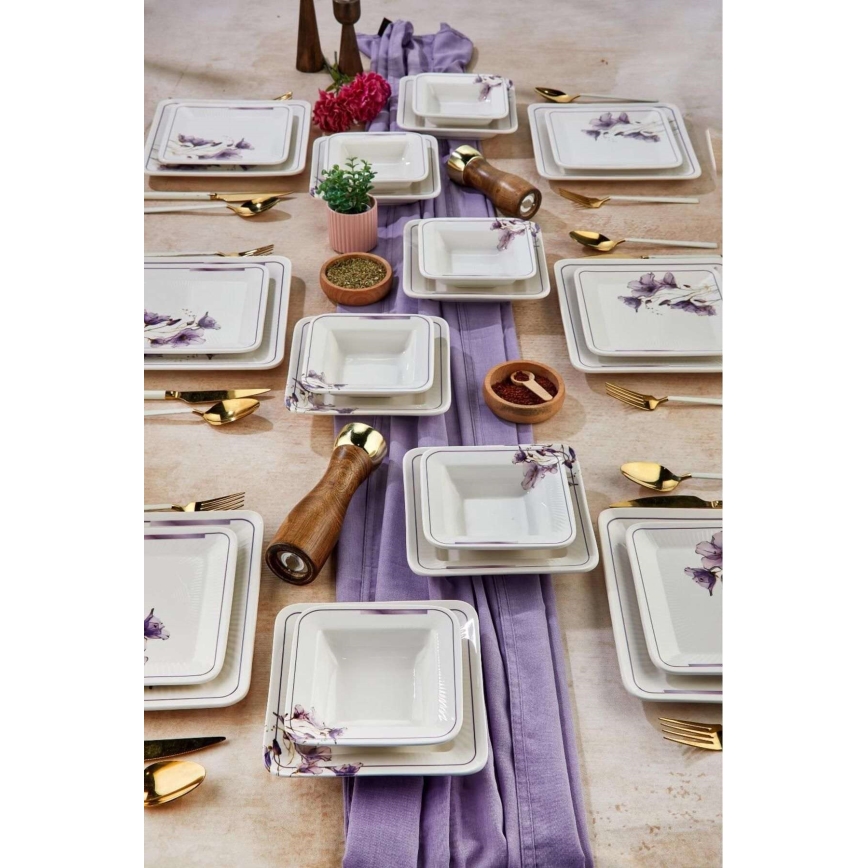 24-piece ceramic dinnerware set in white and purple