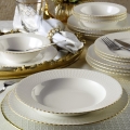 24-piece porcelain dining set in white with gold trim