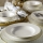 24-piece porcelain dining set in white with gold trim