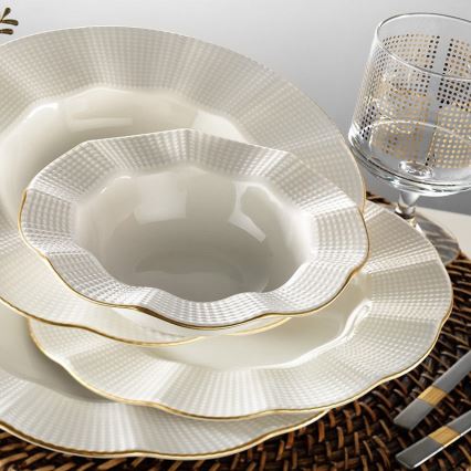24-piece porcelain dinner set in white with gold accents