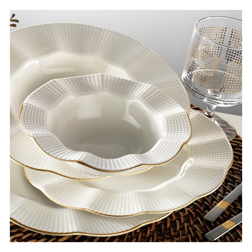 24-piece porcelain dinner set in white with gold accents