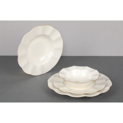 24-piece porcelain dinner set in white with gold accents
