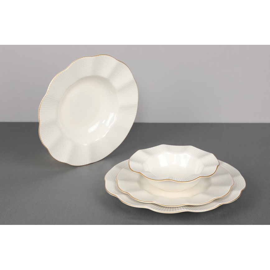 24-piece porcelain dinner set in white with gold accents