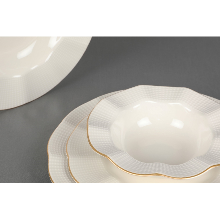 24-piece porcelain dinner set in white with gold accents