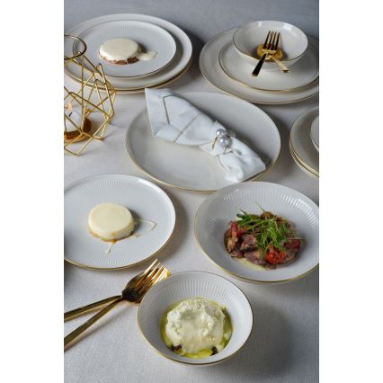 24-piece porcelain dinner set in white with gold trim