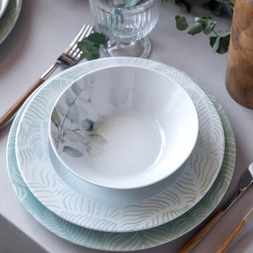 24-piece porcelain dinnerware set in white and green