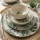 24-piece white and green ceramic dinnerware set