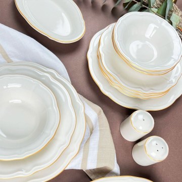 53-piece porcelain dinner set in white with gold accents