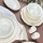 53-piece porcelain dinner set in white with gold accents