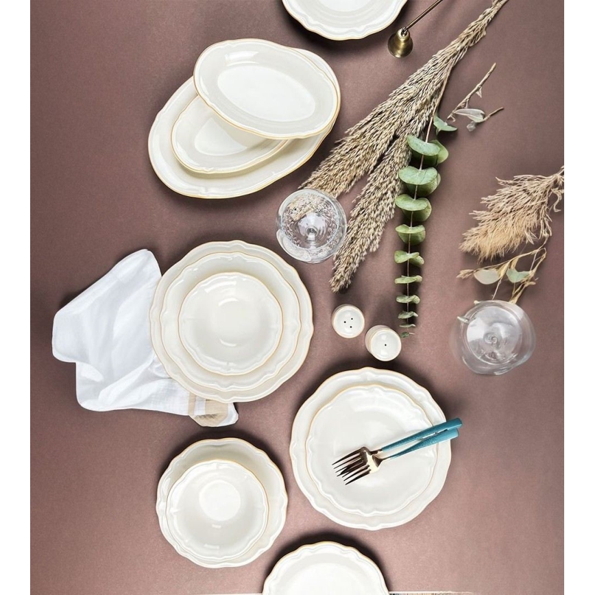 53-piece porcelain dinner set in white with gold accents