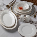 53-piece porcelain dinnerware set — white with gold trim