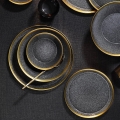 8-piece porcelain dinner set, black with gold trim