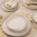 8-piece porcelain dinnerware set in white with gold accents