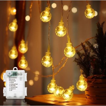 Aigostar - LED Outdoor String Lights 100 LEDs / 3×AA / 8 Modes 10.3 m IP44 Warm White