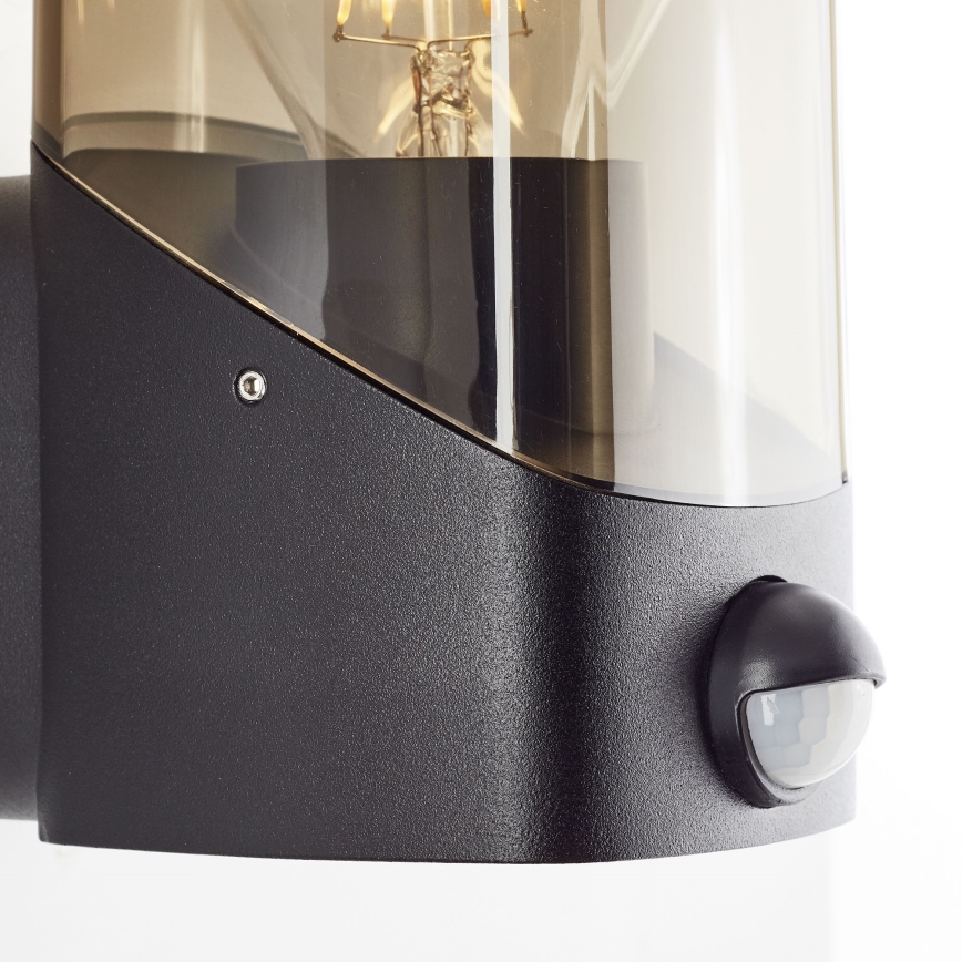 Brilliant - Outdoor wall light with a sensor MINOU 1xE27/10W/230V IP44 black/smoky