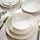 Elegant 24-piece porcelain dinnerware set in white and green