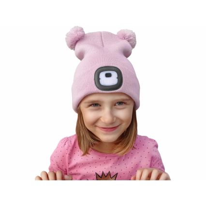 Extol - Children's beanie with built-in USB-rechargeable 250 mAh LED headlamp, pink with pom-poms