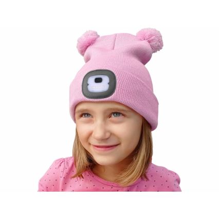 Extol - Children's beanie with built-in USB-rechargeable 250 mAh LED headlamp, pink with pom-poms