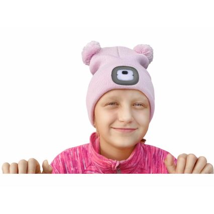 Extol - Children's beanie with built-in USB-rechargeable 250 mAh LED headlamp, pink with pom-poms