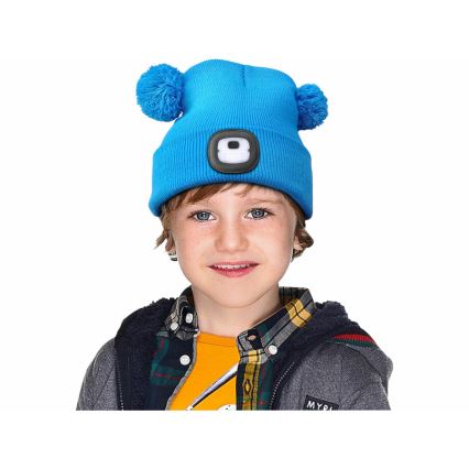 Extol - Kids' beanie with headlamp, USB-rechargeable 250 mAh, blue with pom-poms
