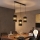 LED cable-suspended chandelier BOGART 3xE27/15W/230V black/gold