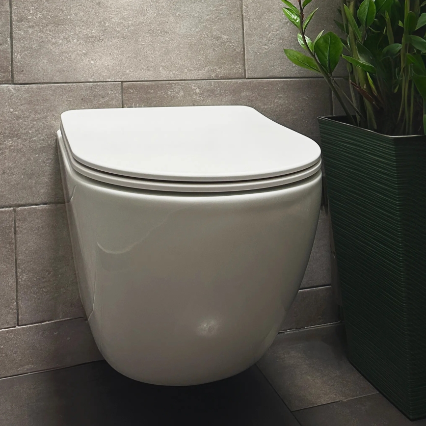 REA-C1259 - Wall-hung toilet with seat CARLO MINI TORNADO RIMLESS ceramic/glossy white