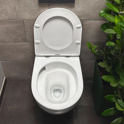 REA-C1259 - Wall-hung toilet with seat CARLO MINI TORNADO RIMLESS ceramic/glossy white